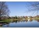 Picturesque pond view with fountain and walking path at 6967 Bluffridge Way, Indianapolis, IN 46278