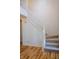 Traditional staircase with carpet steps and white wood railing at 6967 Bluffridge Way, Indianapolis, IN 46278