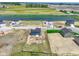 Aerial view of new construction home with nearby pond and green space in new development at 7167 Finley Creek Dr, Whitestown, IN 46075