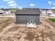 New construction home featuring a patio with chairs and a spacious backyard on a sunny day at 7167 Finley Creek Dr, Whitestown, IN 46075