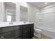 Bright bathroom featuring a double sink vanity with modern fixtures and a shower-tub combination at 7167 Finley Creek Dr, Whitestown, IN 46075