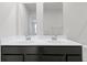 Bathroom featuring a double sink vanity with modern fixtures and bright white countertops at 7167 Finley Creek Dr, Whitestown, IN 46075
