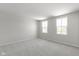 Spacious, naturally lit bedroom with neutral paint and large windows at 7167 Finley Creek Dr, Whitestown, IN 46075