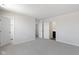 Bright bedroom with neutral walls, carpet, and hallway access at 7167 Finley Creek Dr, Whitestown, IN 46075