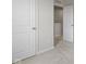 Neutral bedroom featuring plush carpet and white trim leading to another room at 7167 Finley Creek Dr, Whitestown, IN 46075