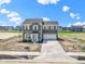 Charming two-story home with a light blue door and an attached two-car garage at 7167 Finley Creek Dr, Whitestown, IN 46075