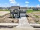 Beautiful exterior of a two-story home with a wide driveway and landscaped front yard at 7167 Finley Creek Dr, Whitestown, IN 46075