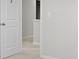 Bright hallway featuring neutral paint, carpeted floors, and white trim at 7167 Finley Creek Dr, Whitestown, IN 46075