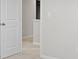 Neutral hallway with carpet and white trim leading to the next room at 7167 Finley Creek Dr, Whitestown, IN 46075
