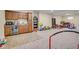 Basement features a tiled wet bar and abundant space for entertainment at 7714 Black Walnut Dr, Avon, IN 46123