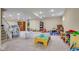 Spacious carpeted basement area, perfect as a playroom or rec room at 7714 Black Walnut Dr, Avon, IN 46123