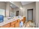 Spacious bathroom with double sinks, a large mirror, and ample countertop space at 7714 Black Walnut Dr, Avon, IN 46123