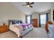 Comfortable main bedroom with hardwood floors and a ceiling fan at 7714 Black Walnut Dr, Avon, IN 46123