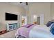 Spacious main bedroom with sitting area, ceiling fan, and ensuite bathroom at 7714 Black Walnut Dr, Avon, IN 46123