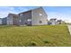 View of siding, windows, and backyard of home in a well-maintained lawn and natural light at 8546 Strabet Dr, Pendleton, IN 46064