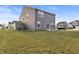 Home exterior with siding, windows, concrete patio, a well-maintained lawn, and a truck at 8546 Strabet Dr, Pendleton, IN 46064
