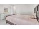 Cozy bedroom with a wooden dresser, soft lighting, carpet, and a comfortable bed at 8546 Strabet Dr, Pendleton, IN 46064