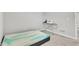 Unfurnished bedroom featuring an ironing board, sewing machine, natural light, and neutral walls at 8546 Strabet Dr, Pendleton, IN 46064