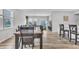 Open-concept dining area flows into the living room with ample natural light and stylish furniture at 8546 Strabet Dr, Pendleton, IN 46064