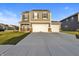 Charming two-story home with an extra garage door, a spacious driveway, and a manicured lawn at 8546 Strabet Dr, Pendleton, IN 46064