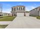Two-story home featuring a three-car garage, neutral color siding and landscaped front yard at 8546 Strabet Dr, Pendleton, IN 46064