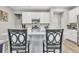 Modern kitchen with white cabinets, stainless steel appliances, and a spacious island with seating at 8546 Strabet Dr, Pendleton, IN 46064