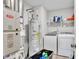 Laundry room features a modern washer and dryer, shelving, and a water heater at 8546 Strabet Dr, Pendleton, IN 46064