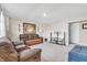 Cozy living room with comfortable sofas, entertainment center, and a warm, inviting atmosphere at 8546 Strabet Dr, Pendleton, IN 46064
