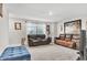 Spacious living room with comfortable seating and lots of light from the large window at 8546 Strabet Dr, Pendleton, IN 46064