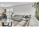 Comfortable living room with a large sectional sofa, coffee table, and views of the dining area at 8546 Strabet Dr, Pendleton, IN 46064