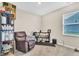 Versatile spare room with comfortable seating, storage shelves, and natural light from the window at 8546 Strabet Dr, Pendleton, IN 46064