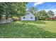 Large grassy backyard with white house at 8553 Broadway St, Indianapolis, IN 46240
