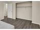 This bedroom features neutral walls, wood floors, and a closet at 8553 Broadway St, Indianapolis, IN 46240