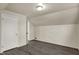 Bedroom with light-colored walls and gray wood laminate flooring at 8553 Broadway St, Indianapolis, IN 46240