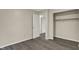 Bedroom featuring new vinyl flooring, white trim and neutral paint and closet at 8553 Broadway St, Indianapolis, IN 46240