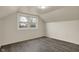 Bright bedroom featuring new vinyl floors and window with a view of nature at 8553 Broadway St, Indianapolis, IN 46240