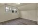 Charming bedroom with new vinyl floors, window, and wall unit air conditioner at 8553 Broadway St, Indianapolis, IN 46240