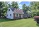 Quaint brick and siding home with a well-maintained lawn and traditional curb appeal at 8553 Broadway St, Indianapolis, IN 46240