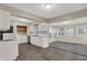 Bright kitchen with white cabinets, modern appliances, and a connected laundry area at 8553 Broadway St, Indianapolis, IN 46240
