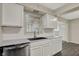 Kitchen featuring white cabinets, stainless steel appliances, and modern fixtures at 8553 Broadway St, Indianapolis, IN 46240