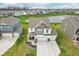 Beautiful aerial view of the property with manicured landscaping, large driveway, and serene pond at 8663 Kellner St, Pendleton, IN 46064