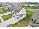 Aerial view of a home with a well-manicured lawn and a pond in the backyard of the property at 8663 Kellner St, Pendleton, IN 46064