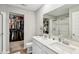 Bathroom features double sinks, ample counter space, a large mirror, and an adjacent walk-in closet at 8663 Kellner St, Pendleton, IN 46064