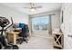 Bright room with a ceiling fan, large window, workstation setup, and exercise bike at 8663 Kellner St, Pendleton, IN 46064
