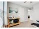 Bedroom with a ceiling fan, neutral walls, a printer on a table, and a door leading to another room at 8663 Kellner St, Pendleton, IN 46064