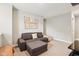 Relaxing bonus room features neutral walls, carpeted floors, and a comfortable sectional sofa with ottoman at 8663 Kellner St, Pendleton, IN 46064