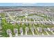 Aerial image showing a residential community with a serene pond and numerous single-Gathering homes at 8663 Kellner St, Pendleton, IN 46064