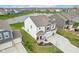 Aerial view showcasing the home's landscaping, long driveway, and charming exterior details at 8663 Kellner St, Pendleton, IN 46064