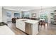 The kitchen island provides a social hub with the open floor plan to the living and dining areas at 8663 Kellner St, Pendleton, IN 46064