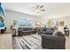 The living room boasts neutral tones with natural light and a ceiling fan at 8663 Kellner St, Pendleton, IN 46064